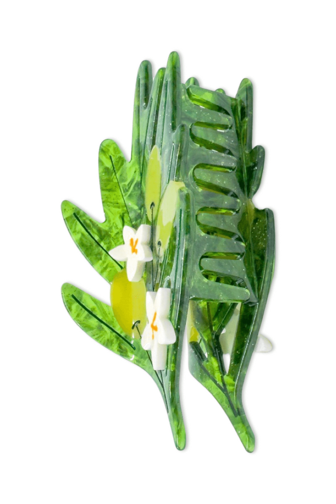 Olive green hair clip with leaf designs on a white background