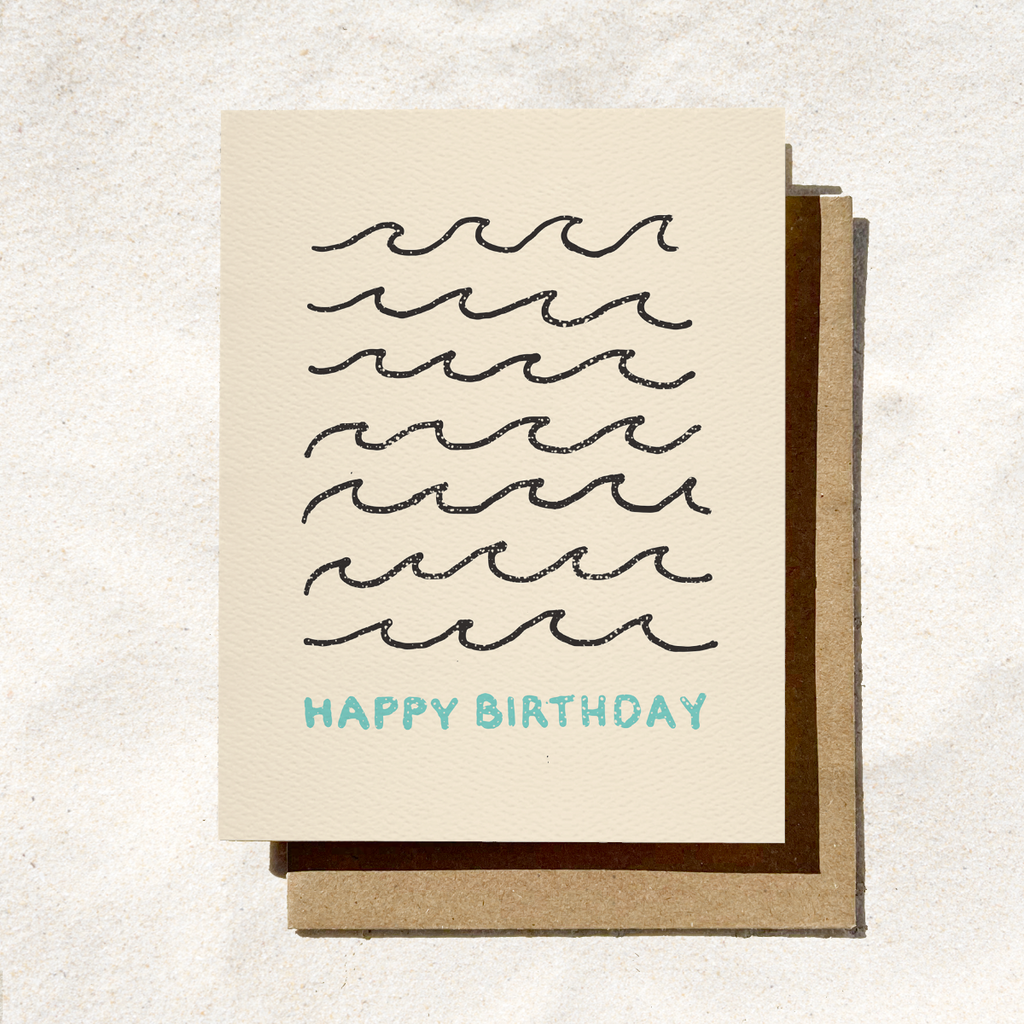 Birthday card with wavy line design and 'Happy Birthday' text on a textured background