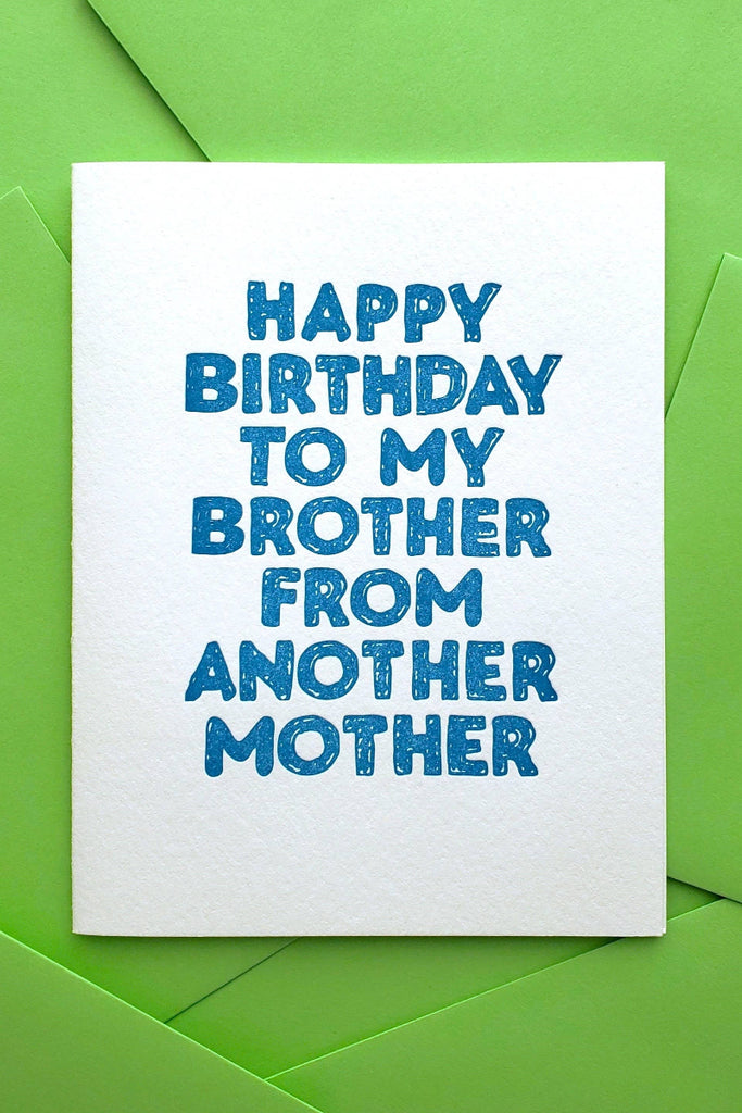 Birthday card with blue text on a green background happy birthday to my brother fom another mother