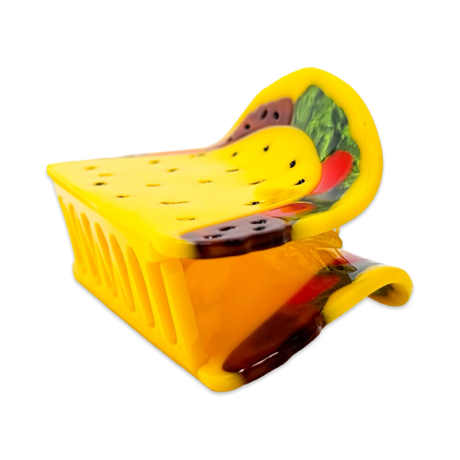Yellow taco shape hair clip with colorful design on a white background