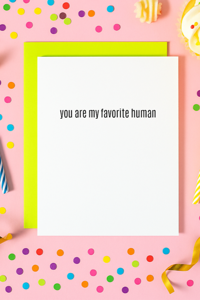 Greeting card with 'you are my favorite human' text on a colorful confetti and cake-themed background.
