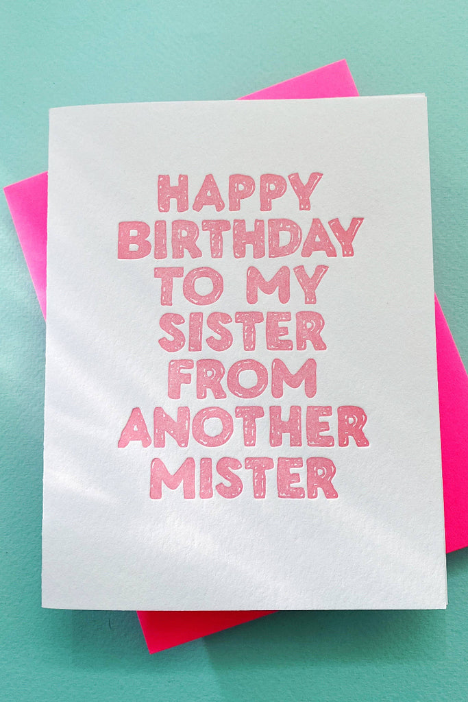Greeting card with 'Happy Birthday to my sister from another mister' text on a turquoise background