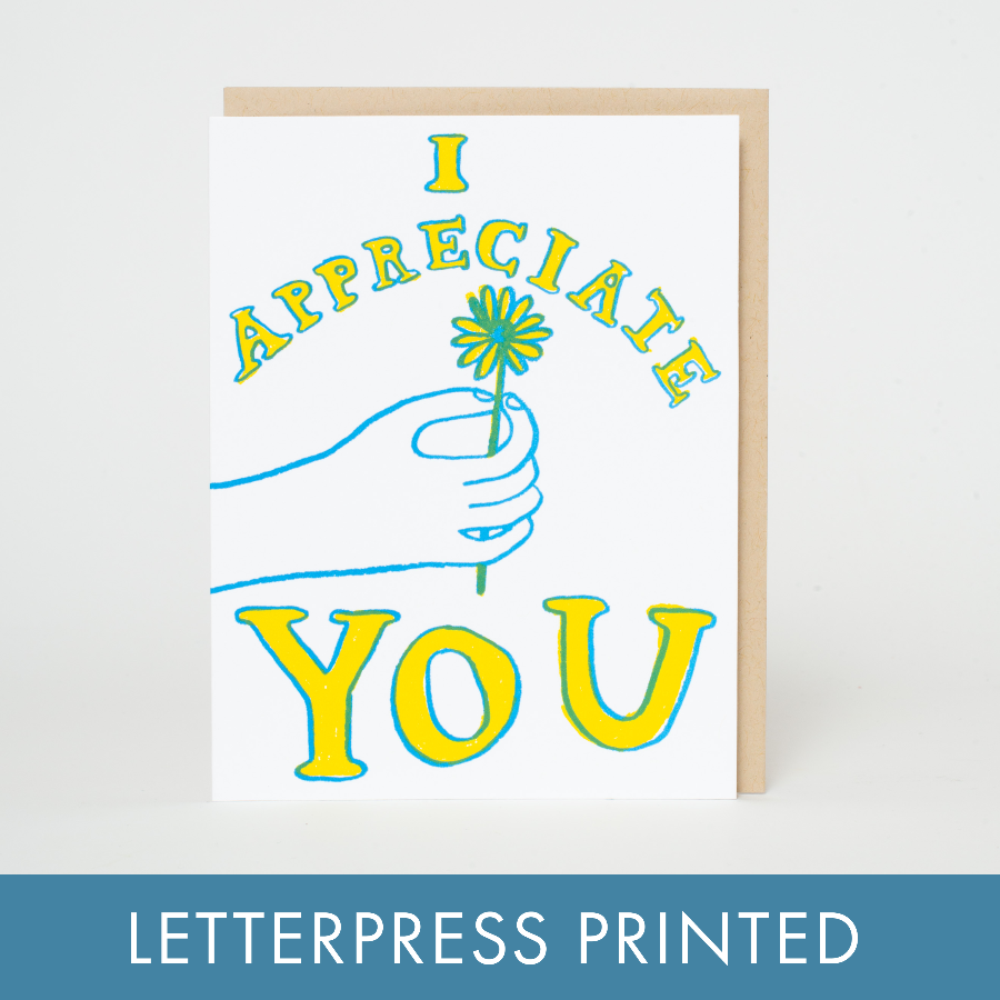 letterpress printed grreting card, thank you card. with 'I appreciate you' text and a hand holding a flower on a white background.