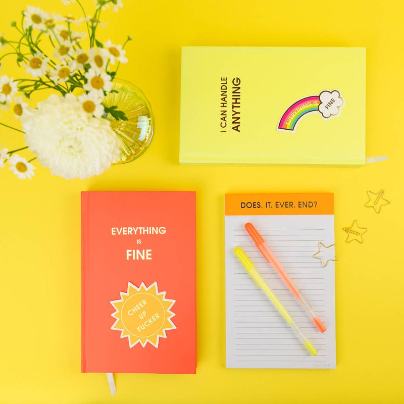 Colorful stationery items including notebooks and a pen on a yellow background with flowers.