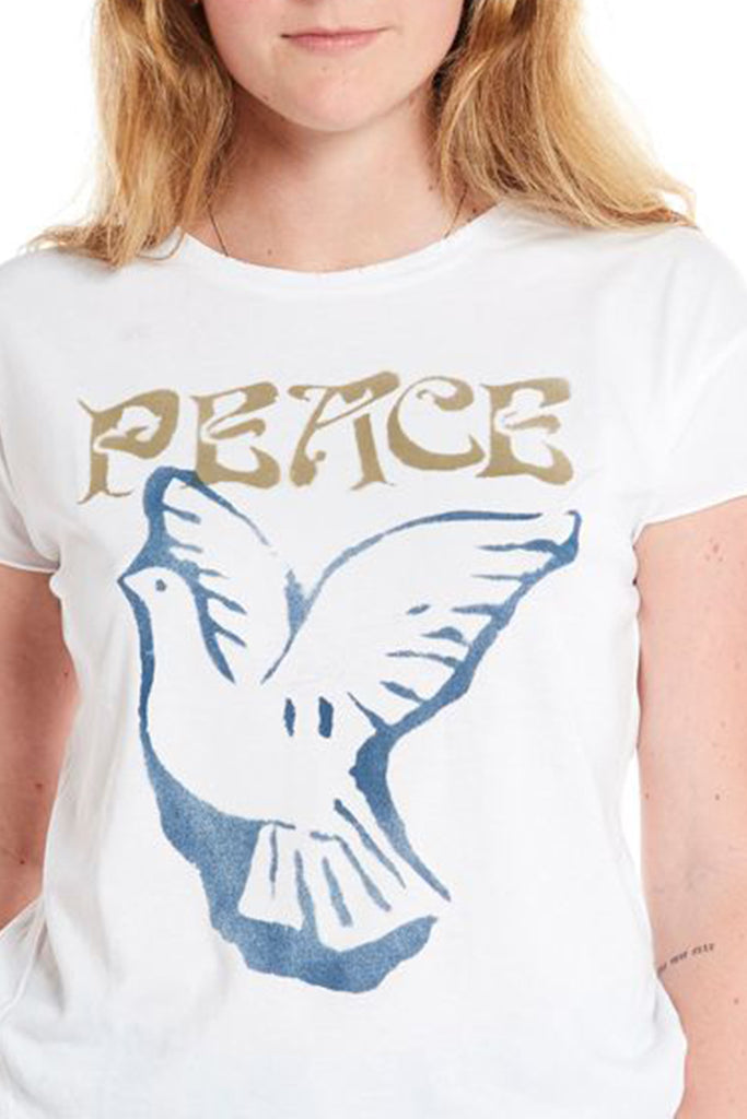 close up of peace dove original art hand-stenciled painted on white cotton rocker tee that has been distressed and pre-washed.